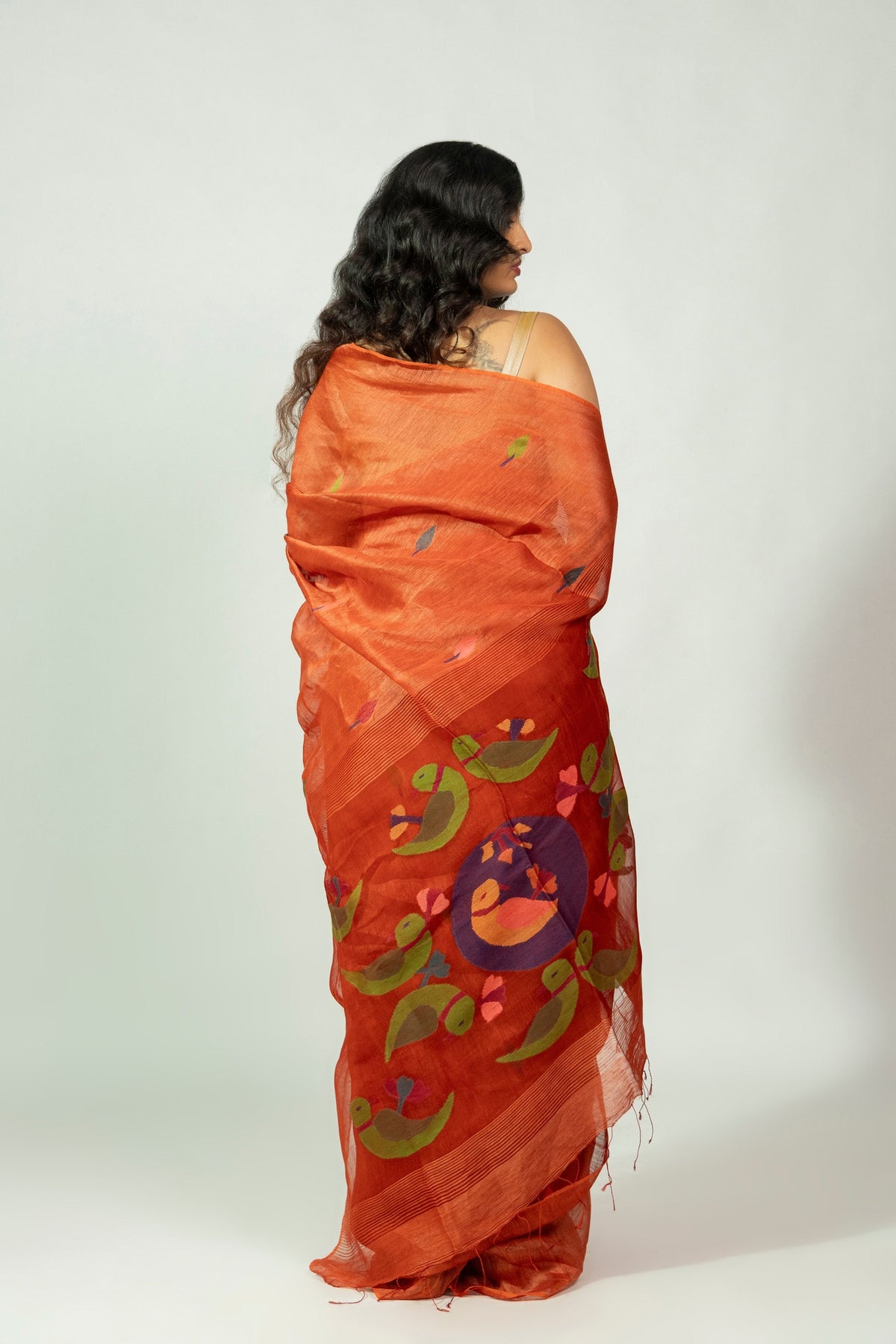 Green parrot motif needle Jamdani pallu on Komola Tia silk linen saree