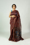 Dark brown silk linen saree with blue leaf motifs