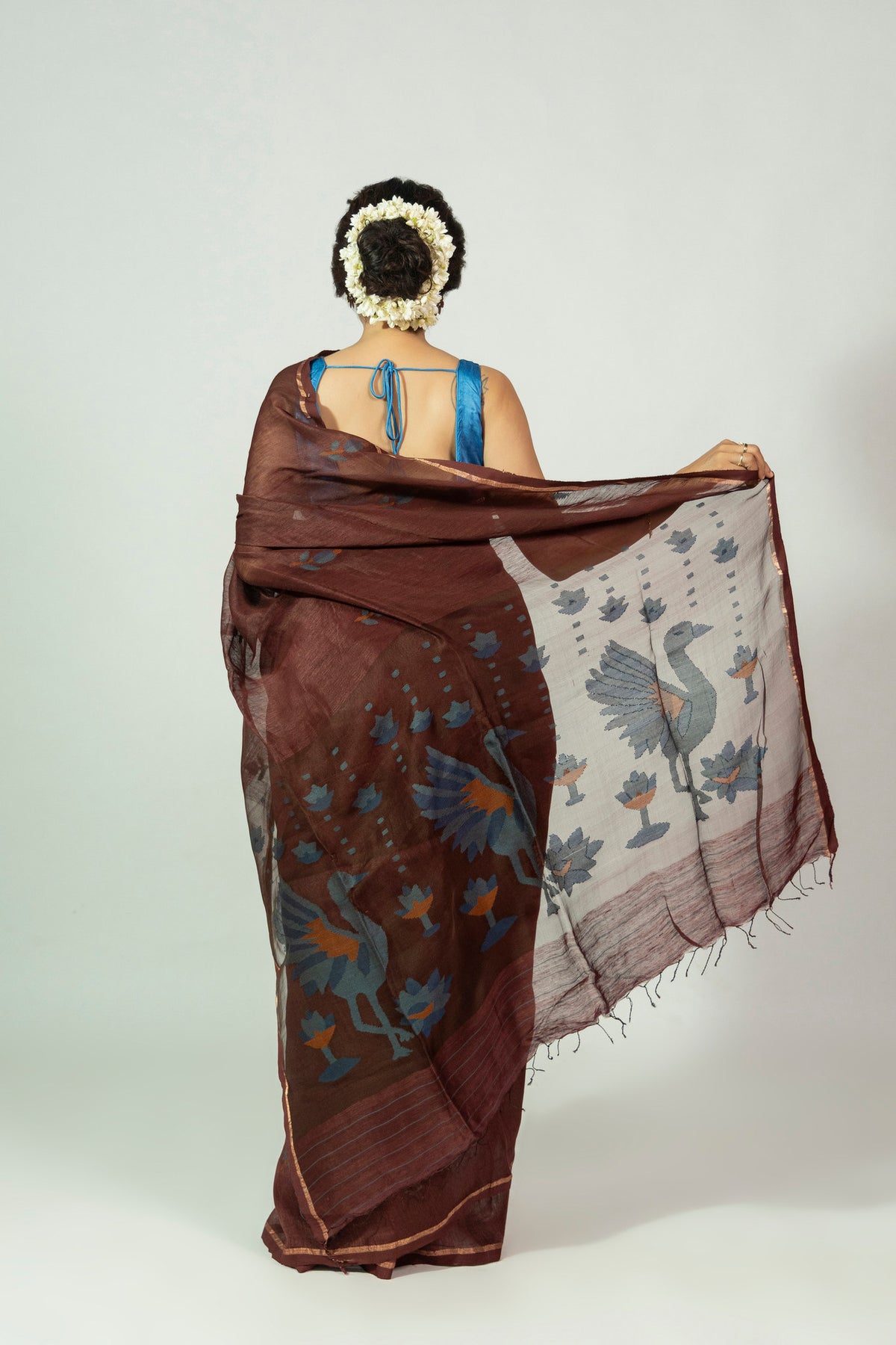 Blue peacock and lotus needle Jamdani pallu on Padma Raat silk linen saree