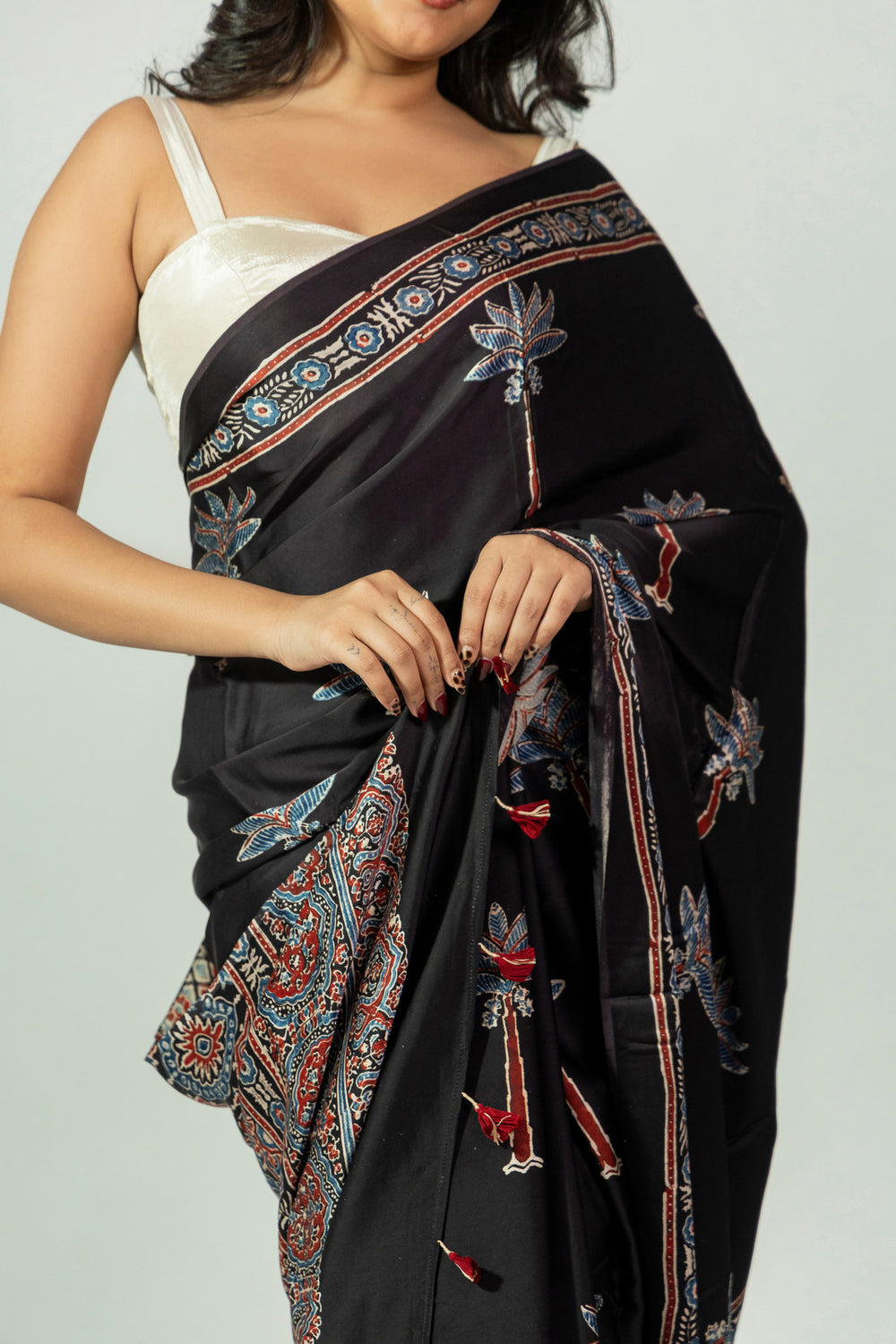 Abstract and floral printed pallu of Rann Ni Raat black Ajrakh saree