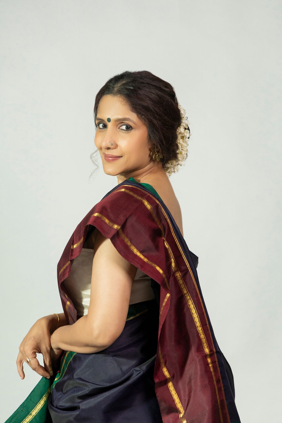 Ratri Neeli Molakalmuru saree showing navy silk body and red border