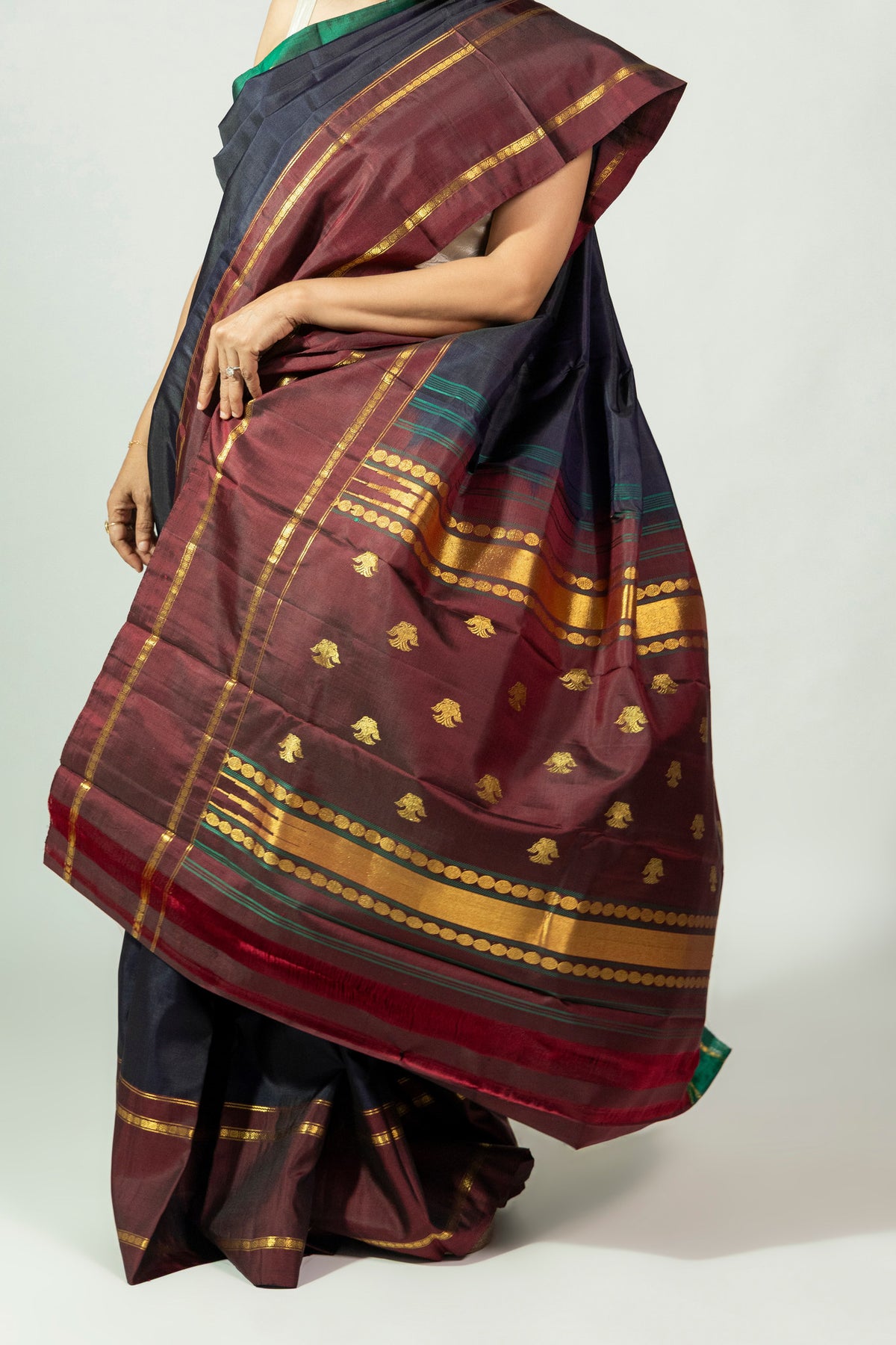 Ratri Neeli Molakalmuru silk saree featuring deep navy body with contrasting red pallu and border